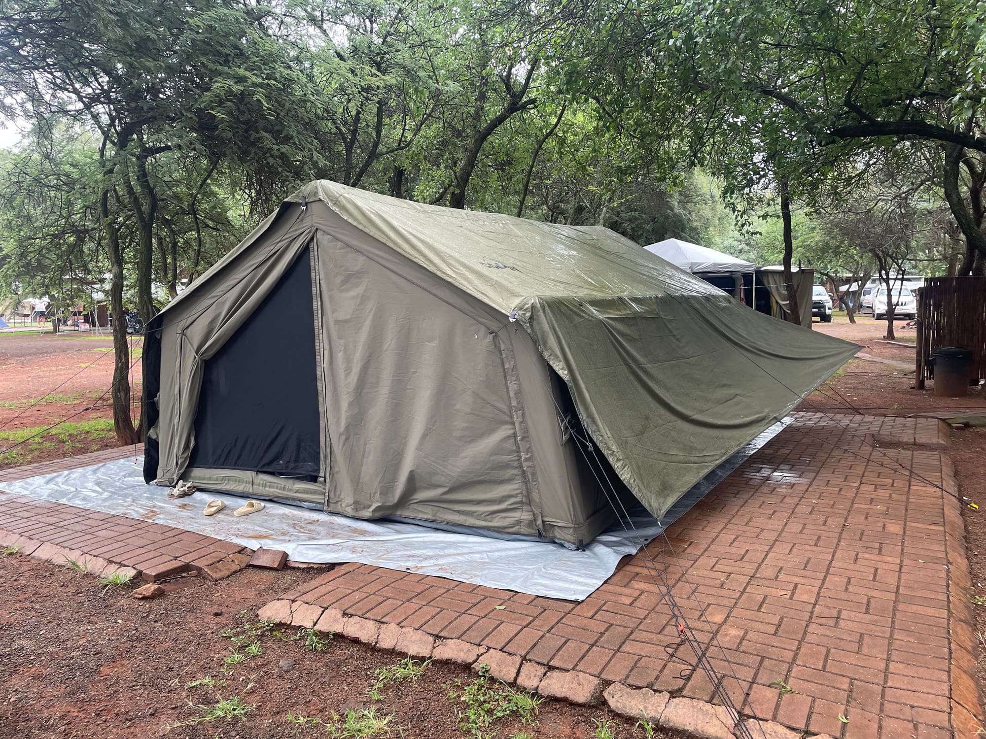 Coody Familia inflatable tent set up under trees at Sondela, Bela Bela on a wet day