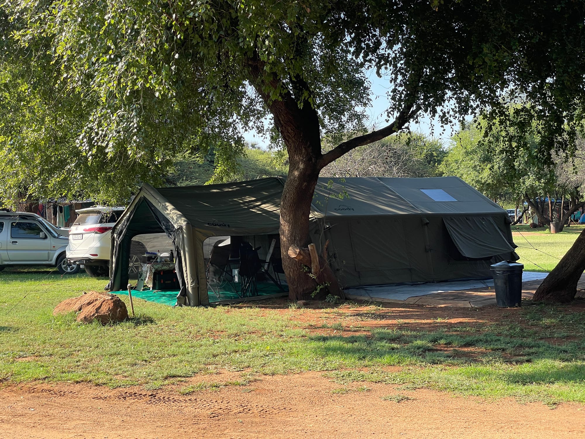 Coody Familia inflatable tent set up under a large tree at Sondela, Bela Bela