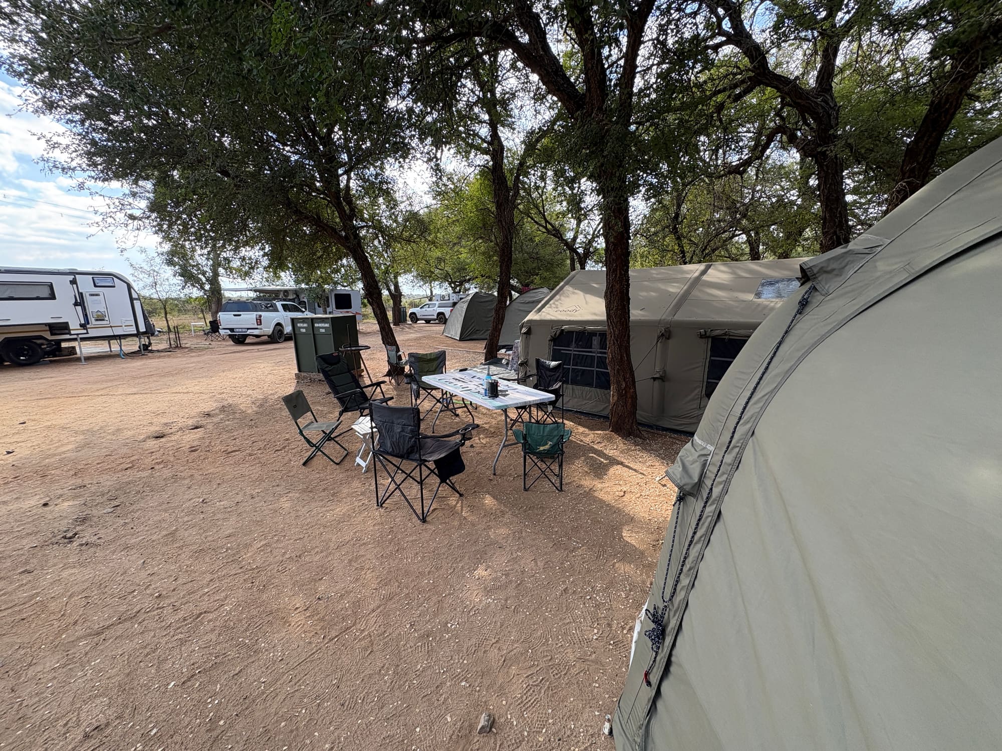 Two Coody Familia tents in army green and a Coody dome tent pitched at Crocodile Bridge campsite