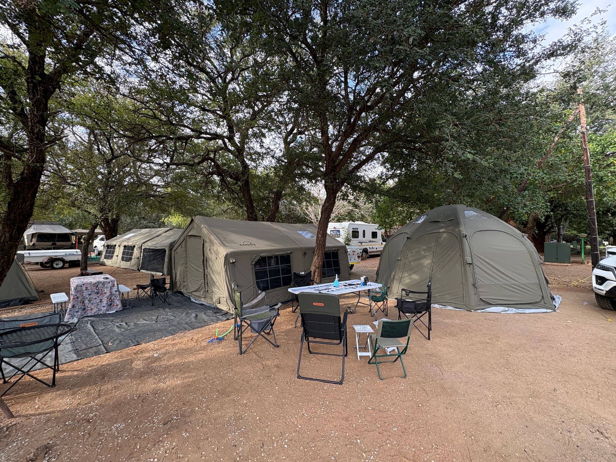 Two Coody Familia tents and a Coody dome tent pitched together at Crocodile Bridge, Kruger National Park