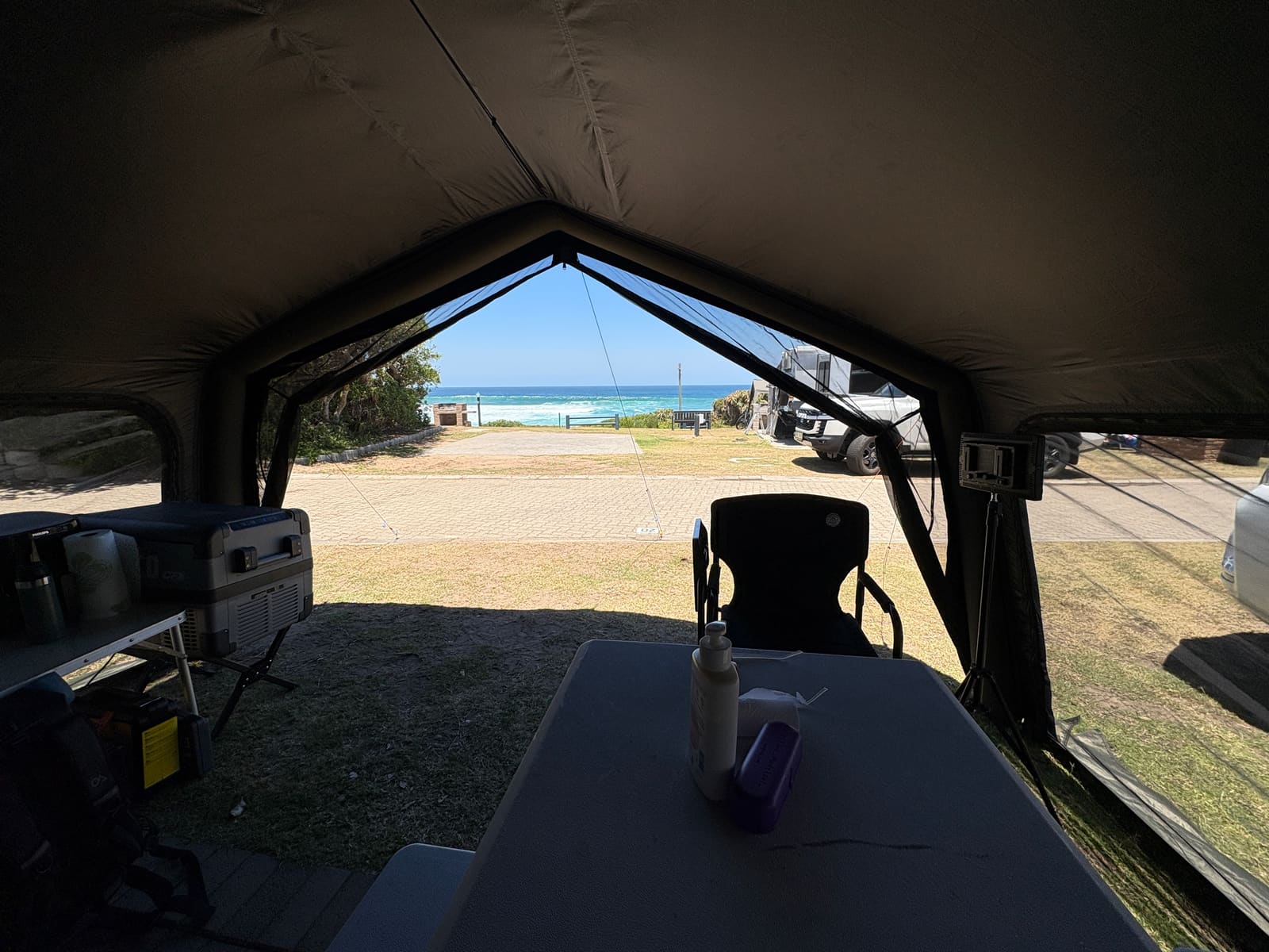 View from inside the Coody Familia tent looking out onto the campsite and ocean