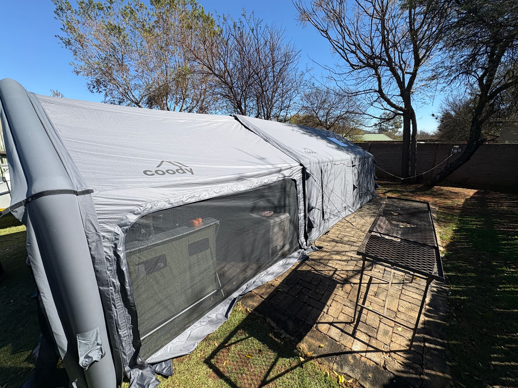 Coody Familia inflatable tent in grey at Konka, Magaliesburg, with the resort's water park visible in the background