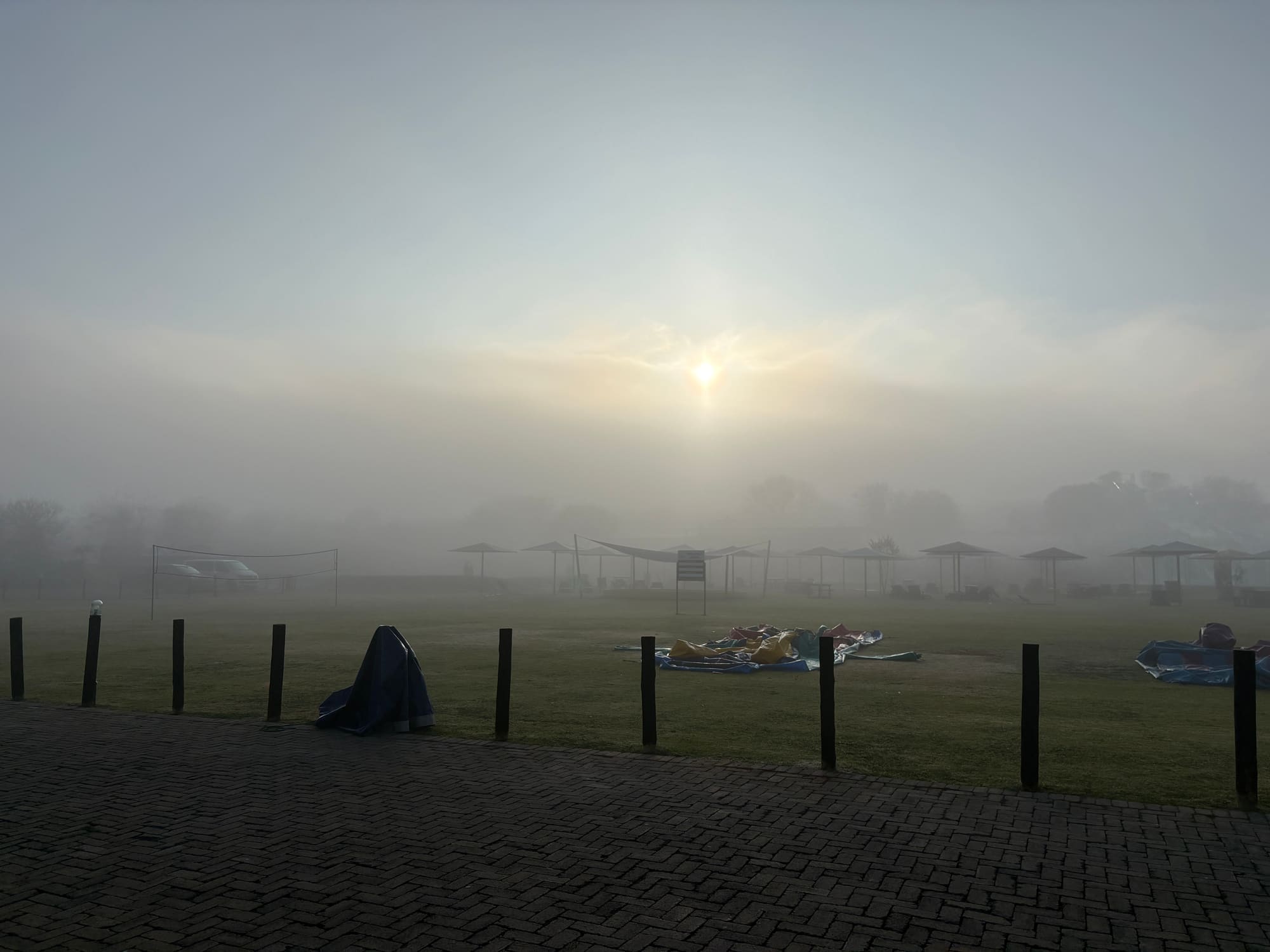 Foggy winter morning at Konka, Magaliesburg resort, the covered Coody dome tent visible on the field