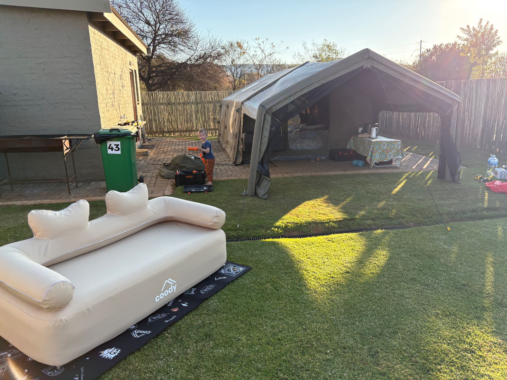 Coody Familia inflatable tent in army green, set up at Konka, Magaliesburg with the inflatable sofa outside