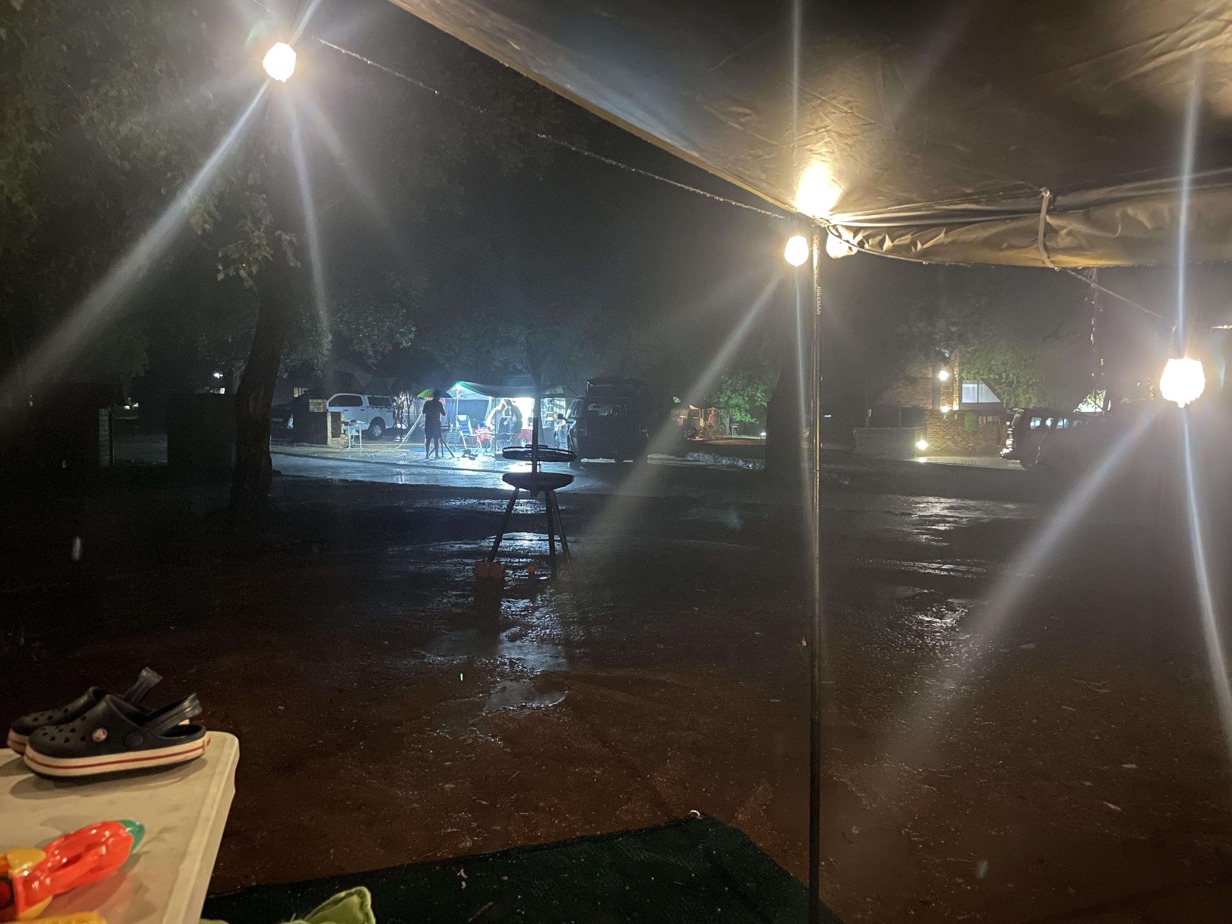 Rainy night at Berg en Dal campsite, Kruger National Park — taken from under the Coody Familia rain fly stoep while others shelter nearby
