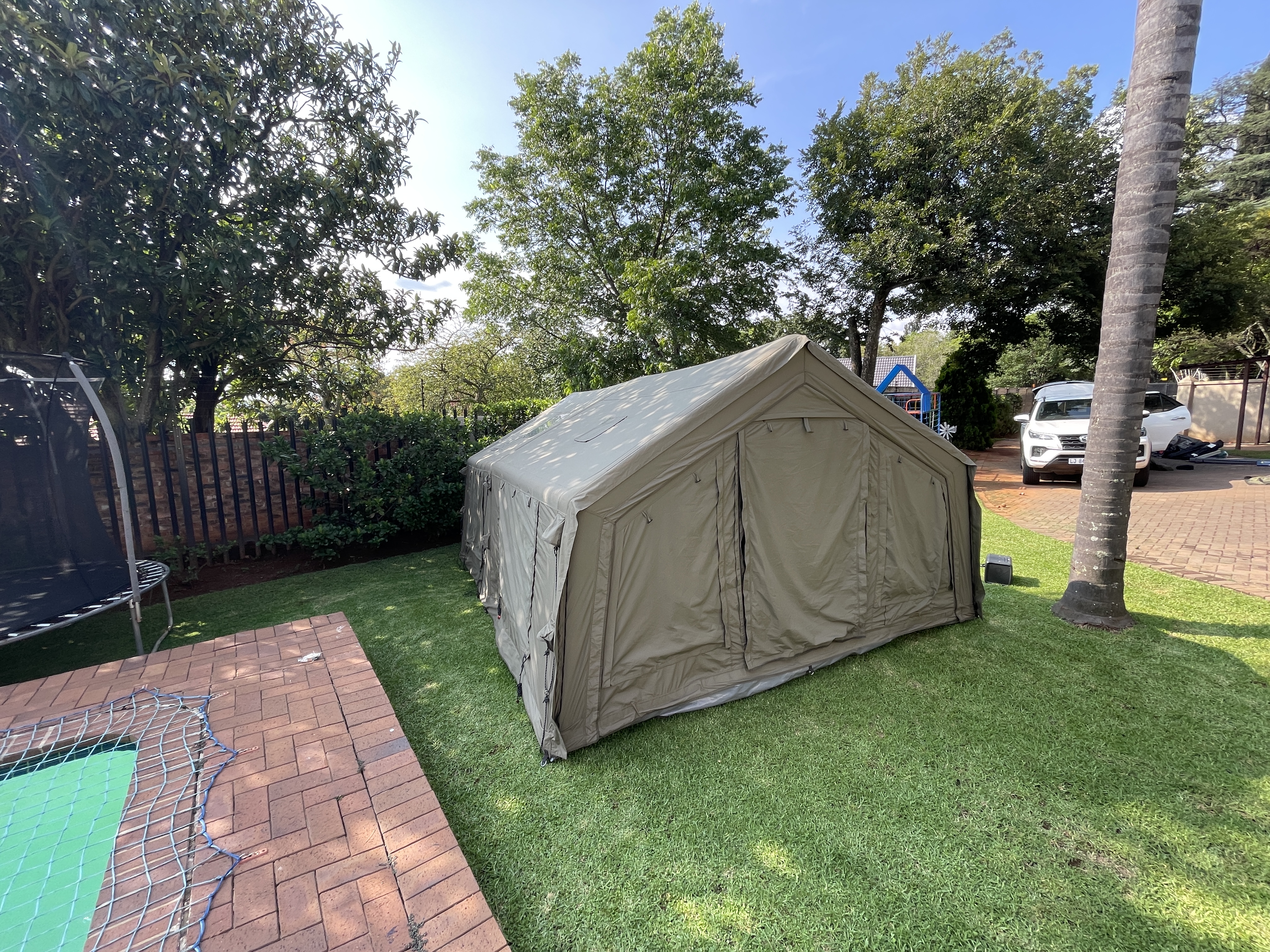 Coody Familia inflatable tent set up in a Johannesburg suburban garden to air out after the Kruger camping trip