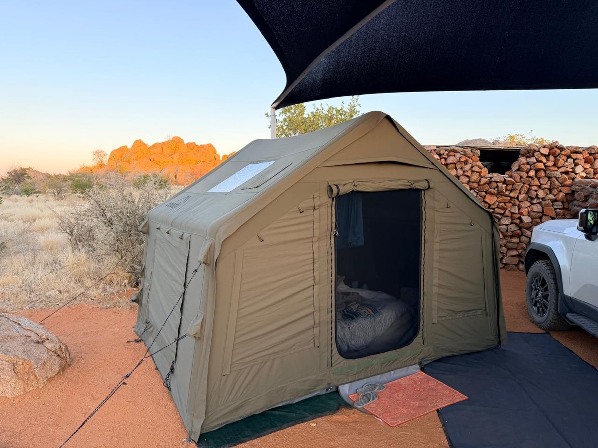 Coody 8 tent at Hoada campsite, Namibia, with the granite boulders glowing red at sunset