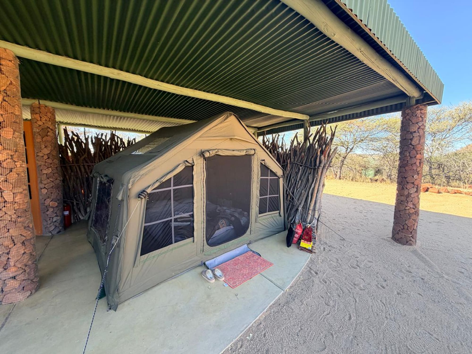 Coody 8 tent pitched under a covered shelter at Okonjima, Namibia
