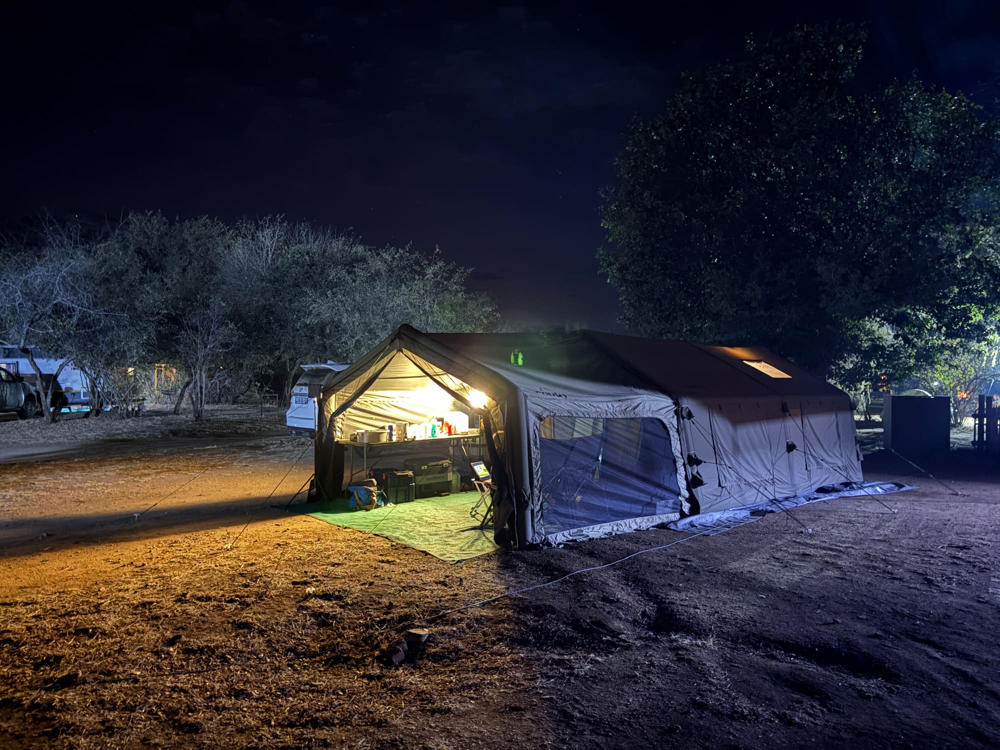 Coody Familia tent lit up at night at Satara campsite, Kruger National Park