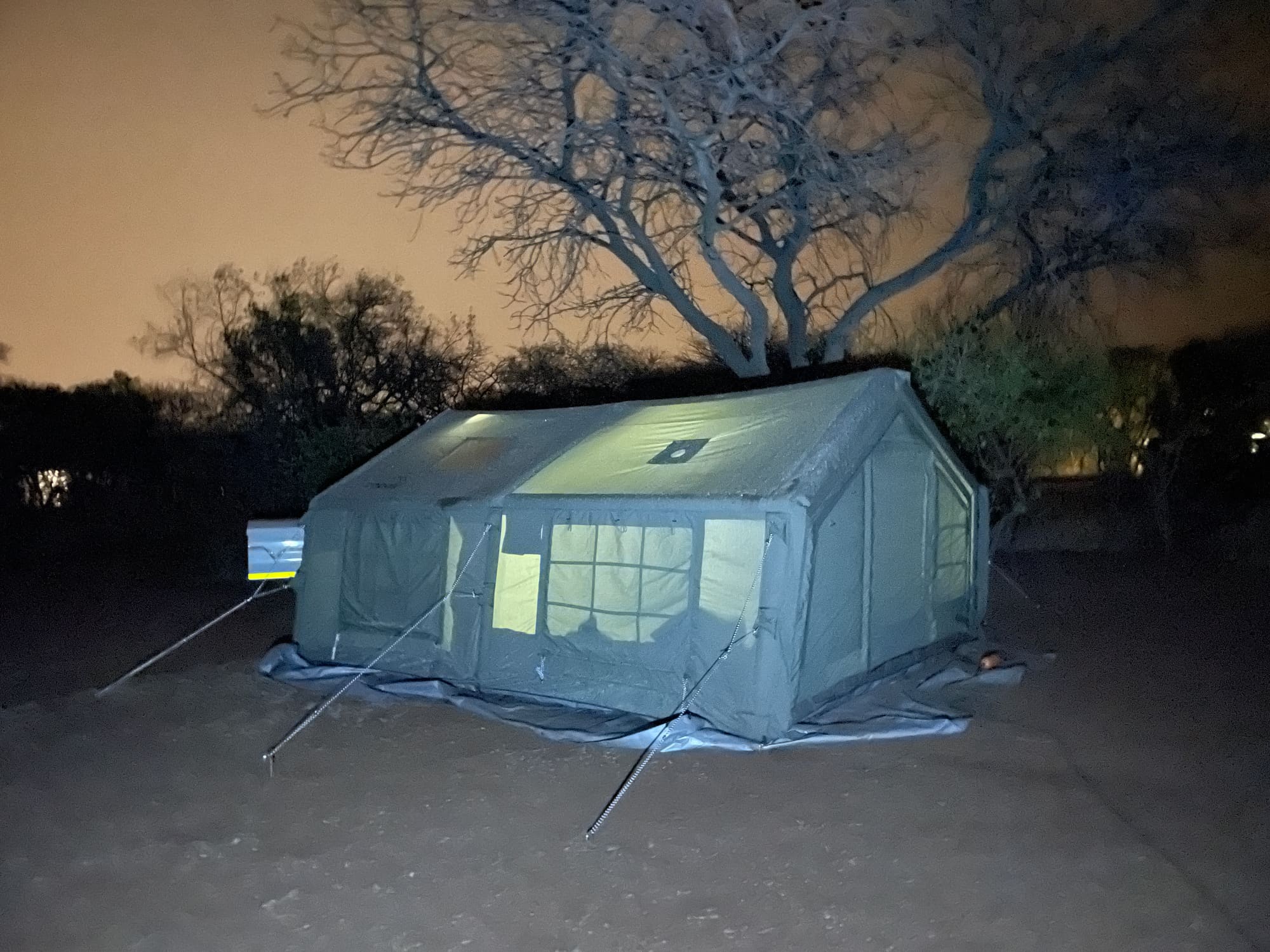 Close-up of Coody branding on the tent roof, covered in dew at night at Willemsrus, Dinokeng