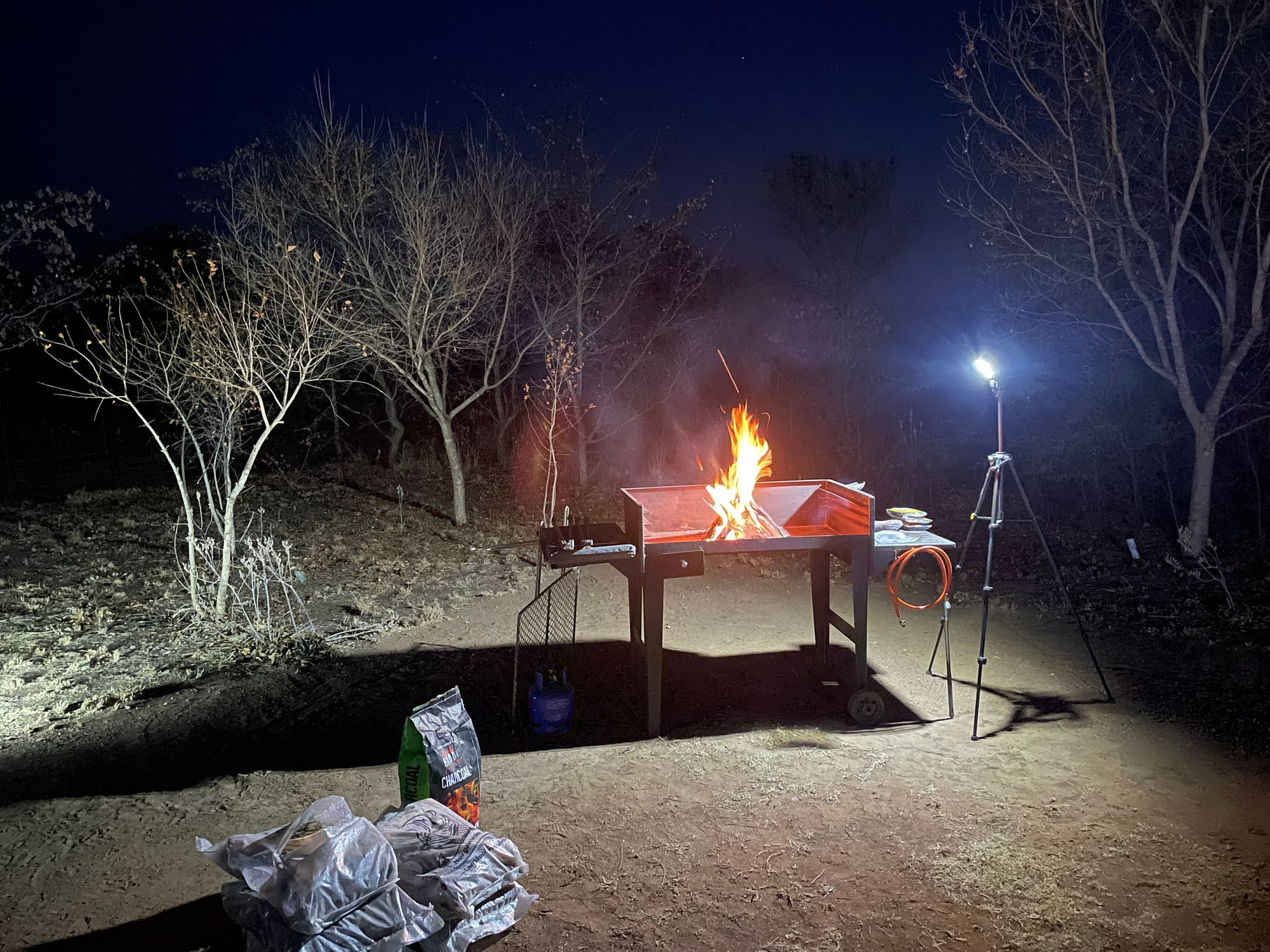 Braai fire burning at night at the Willemsrus, Dinokeng campsite