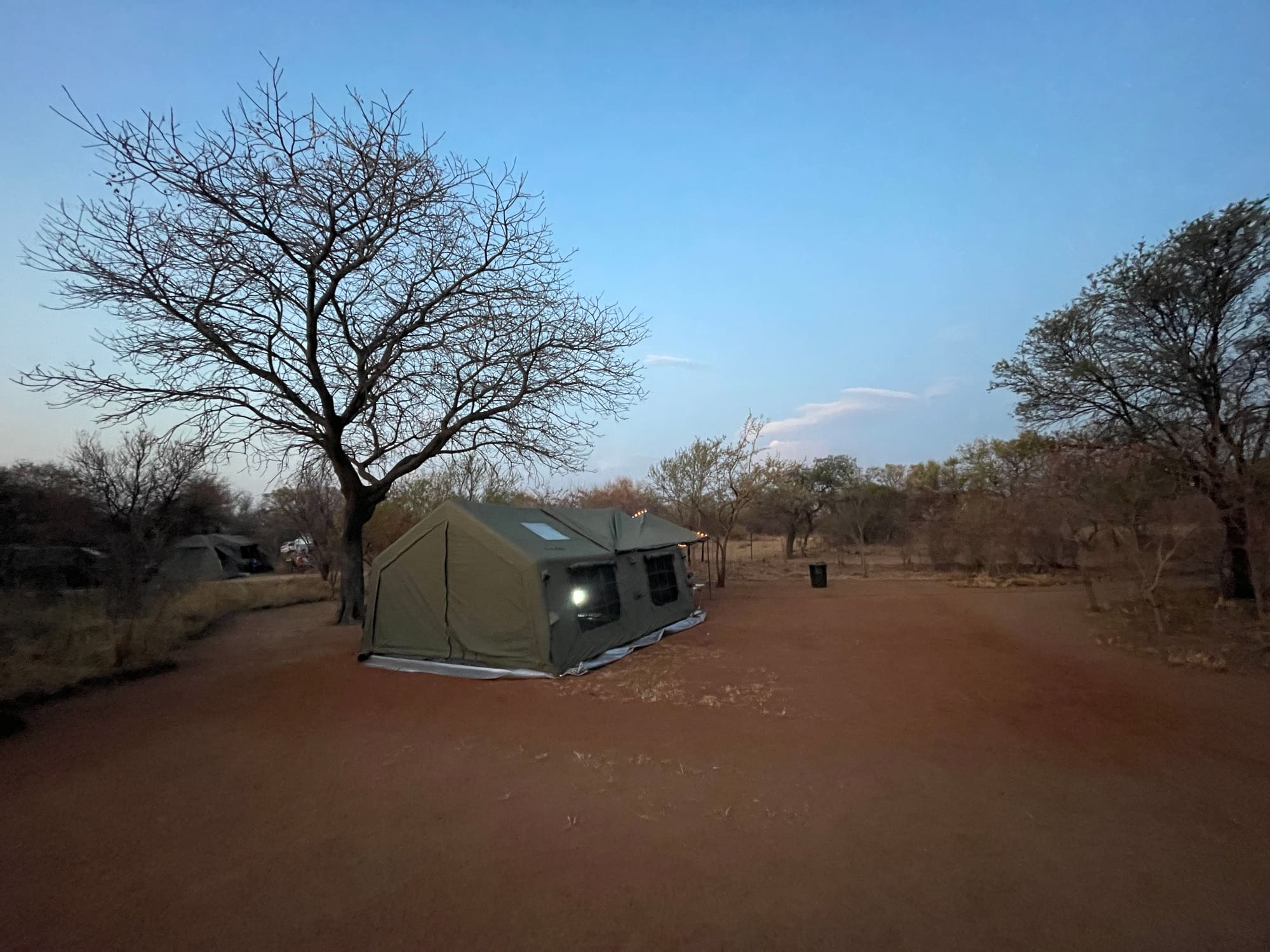 Coody Familia tent glowing at dusk at Willemsrus, Dinokeng, another angle