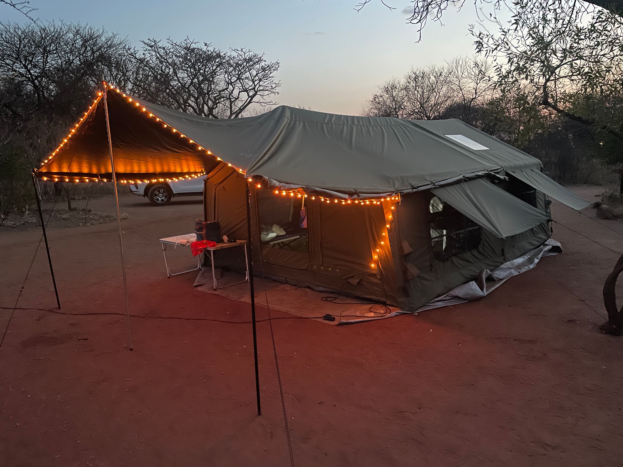 Coody Familia inflatable tent lit up at night at Willemsrus, Dinokeng, string lights strung along the roofline