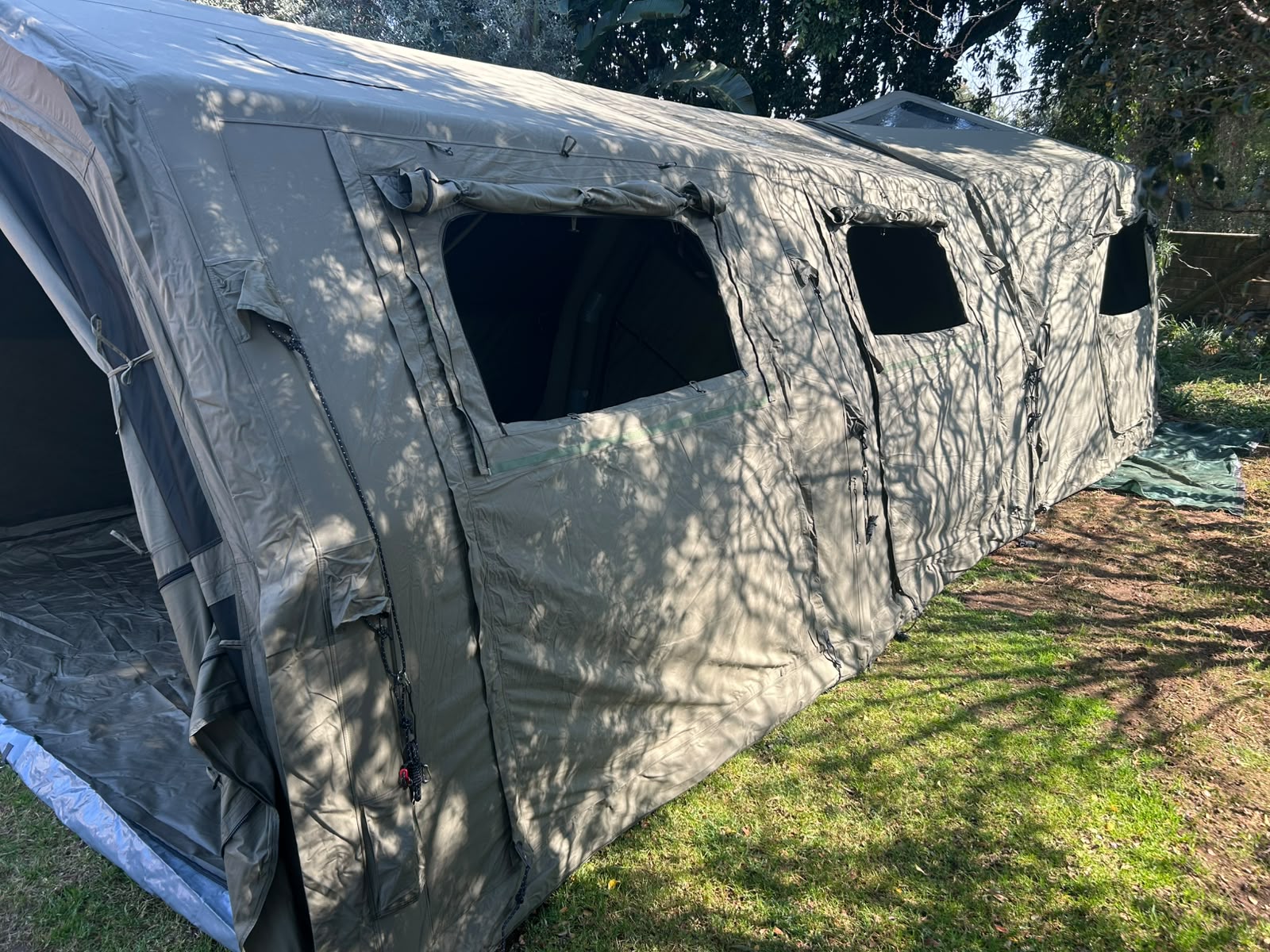 Jadon's army green Coody Familia Pro set up under trees in his garden in Johannesburg